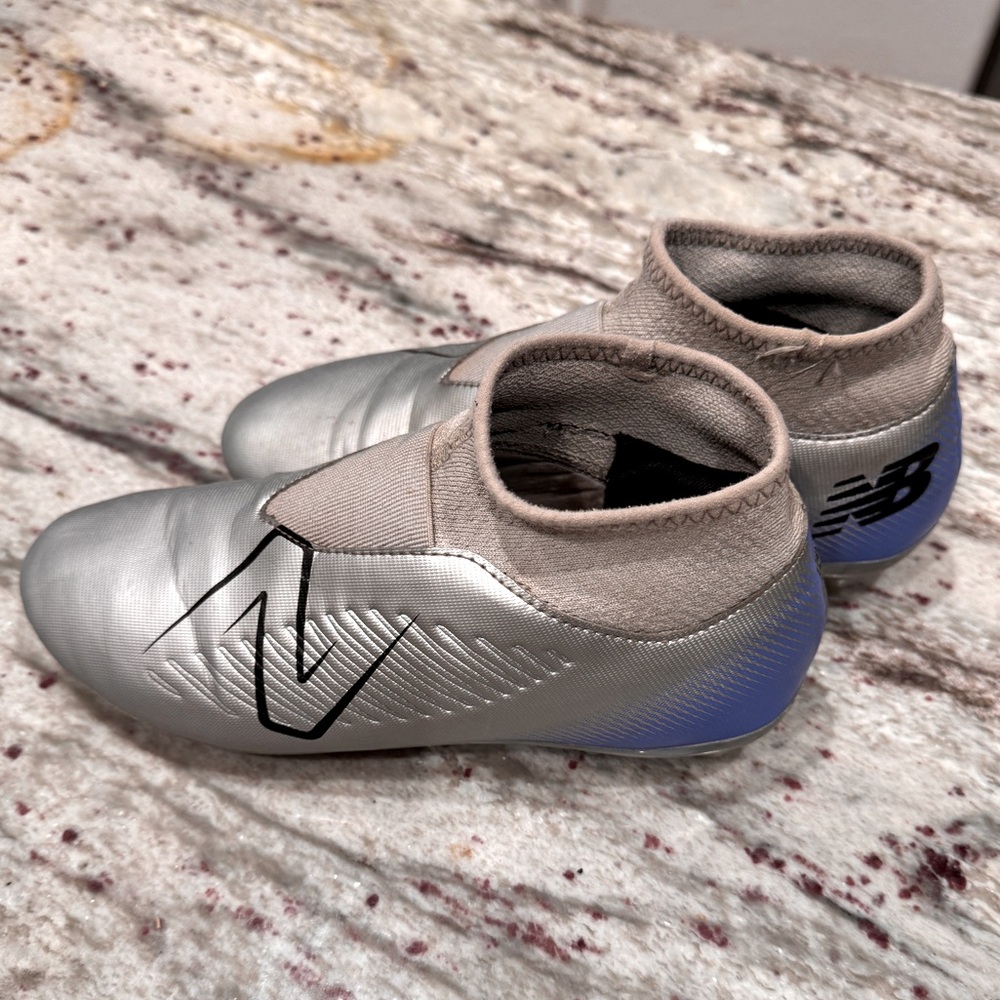 New Balance Tekela laceless soccer cleats
